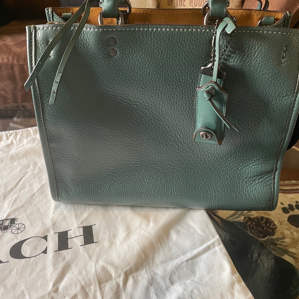 Coach rogue 30 with whipstitch handle in dark turquoise.